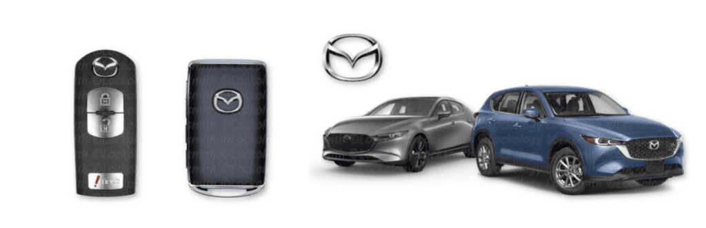 A product showcase of Mazda vehicles and accessories on a white background. On the left side, there are two black Mazda key fobs - one showing the front face with the Mazda logo and another showing the back side with a leather-like texture. In the center, there is a silver Mazda logo emblem. On the right side, there are two Mazda vehicles - a silver Mazda 3 sedan and a blue Mazda CX-5 SUV, both shown at three-quarter angles facing right. The vehicles are rendered in high detail with realistic reflections and shadows. The image has a clean, professional automotive presentation style with even lighting and no shadows.